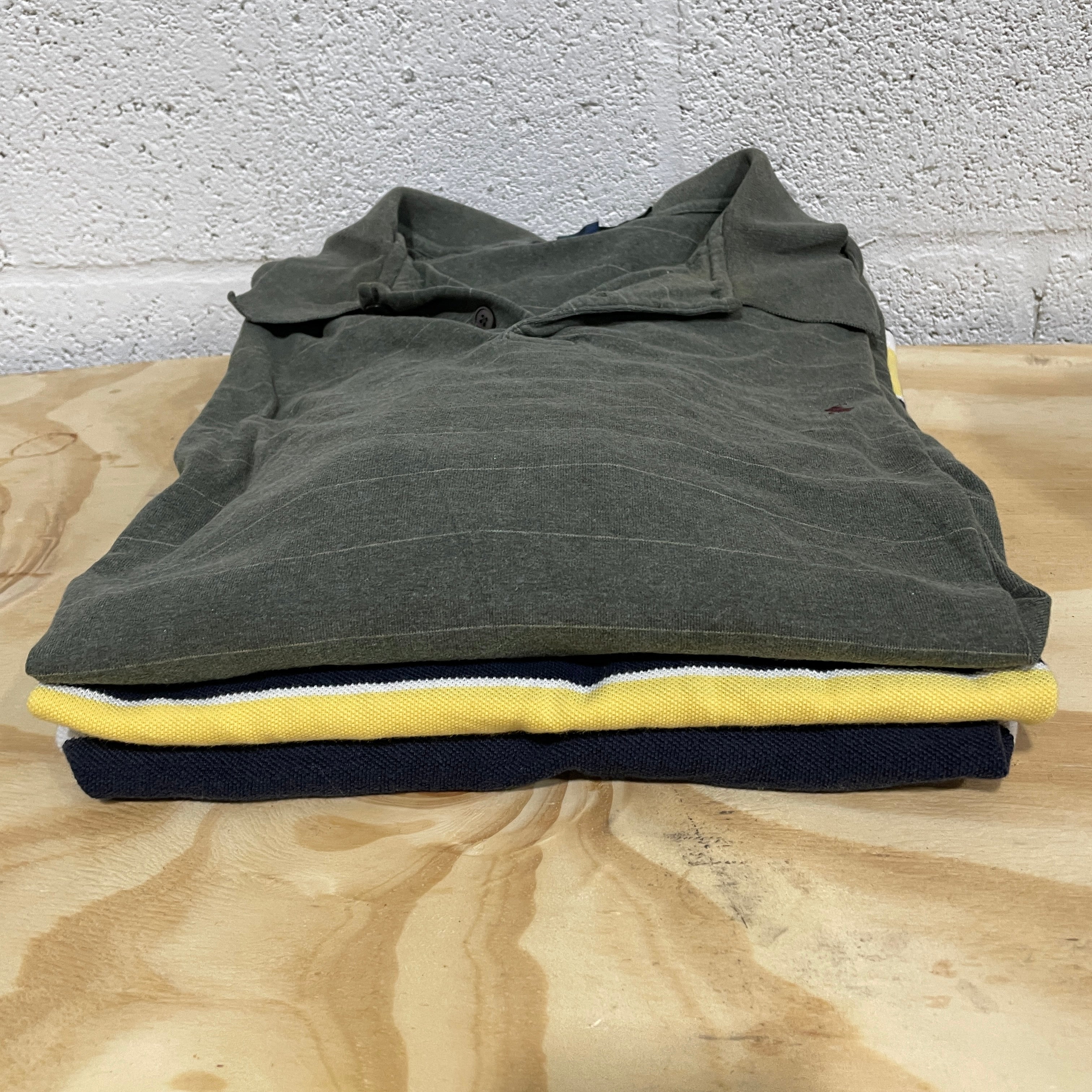Brand Name Polo Shirts on table